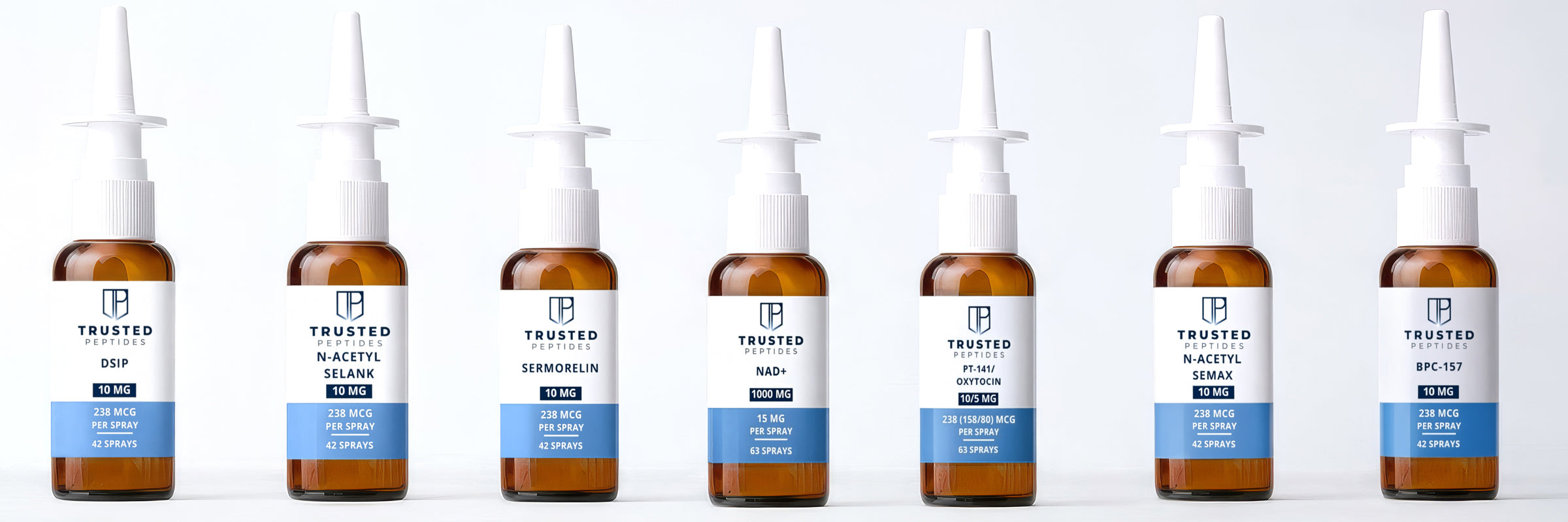 Row of branded skincare bottles with droppers on a white background